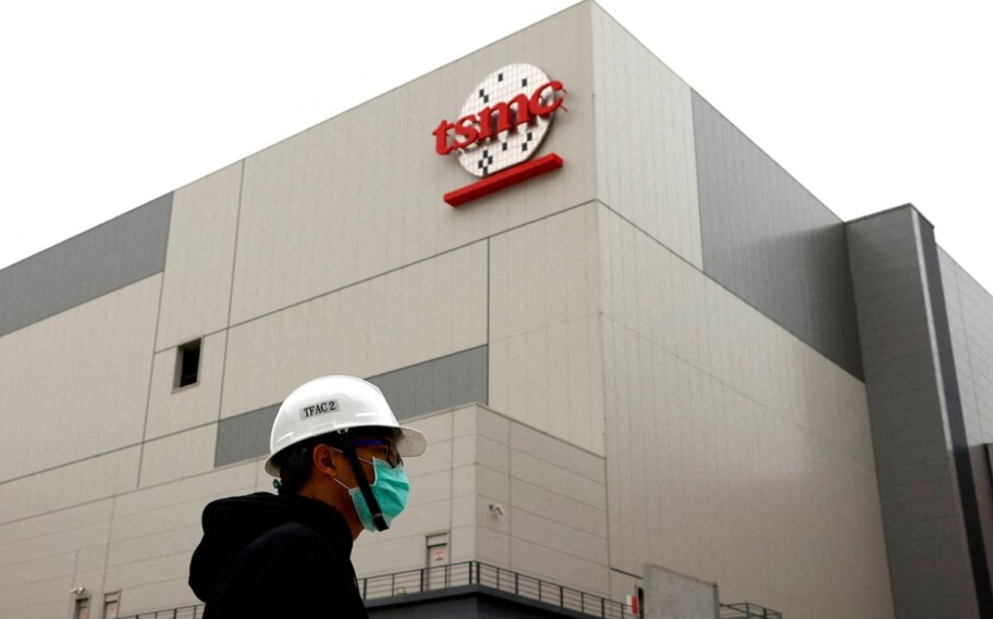 TSMC building with worker passing in front